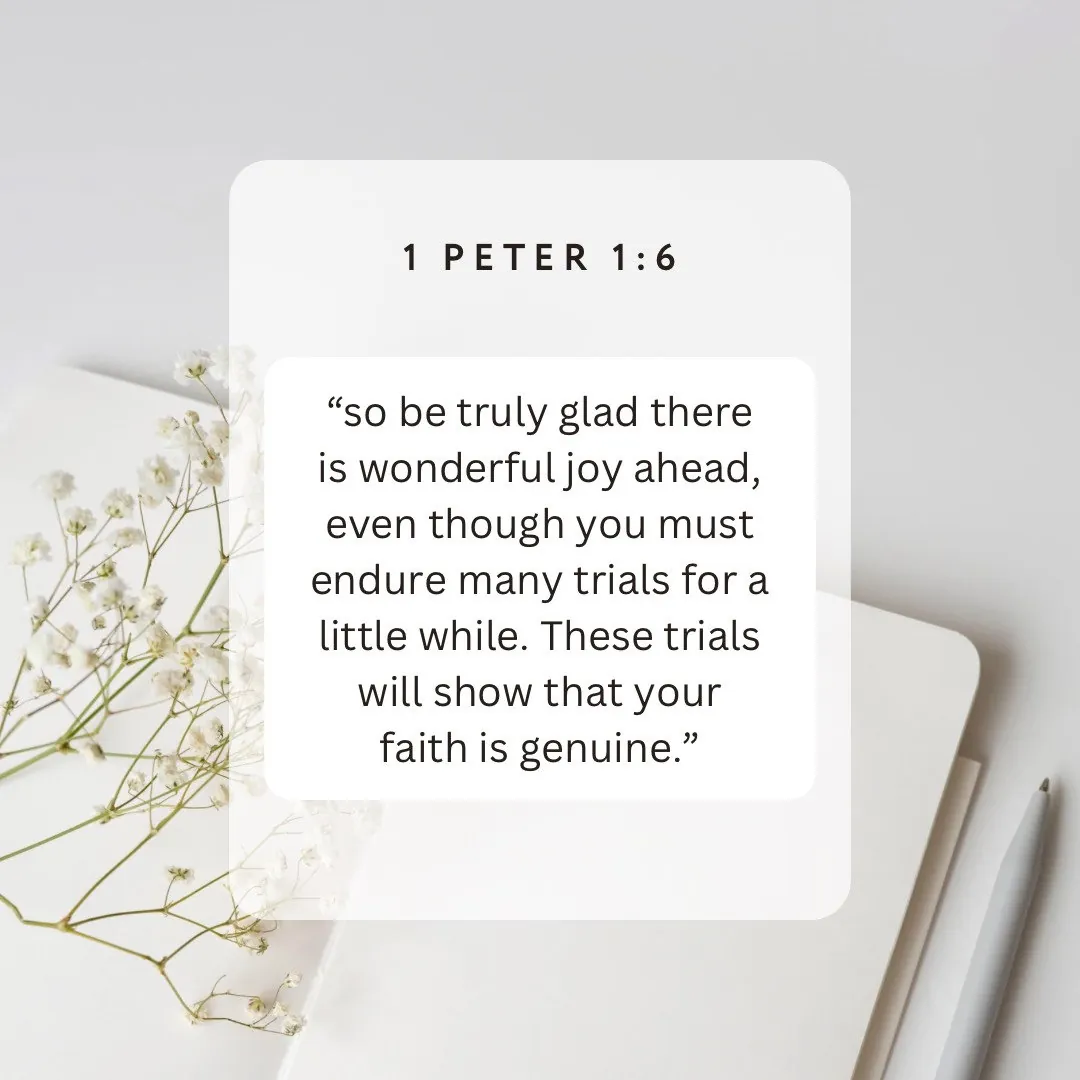 1 Peter 1:6 on joy ahead through trials, on a card beside baby's breath